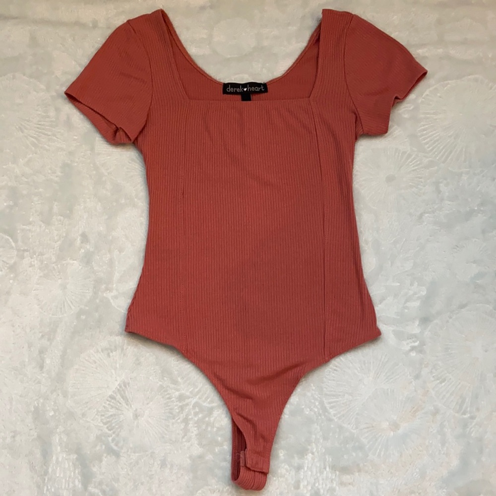 Pink body suit